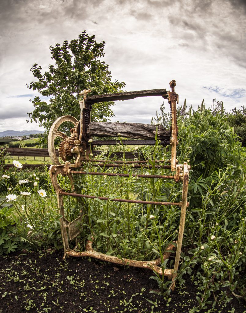 Old Washing Mangle in the Welshot Imaging Photographic Academy Wildflower Garden on Anglesey, North Wales