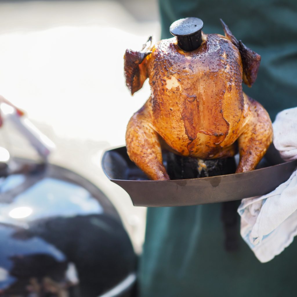 Photograph of a Chef cooking a Chicken on a Webber BBQ at the Kent Cookery School